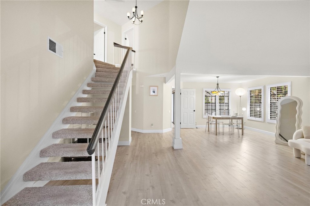 6 Fieldflower Irvine, CA 92614 - Photo 5 of 39 a view of entryway and hall with wooden floor