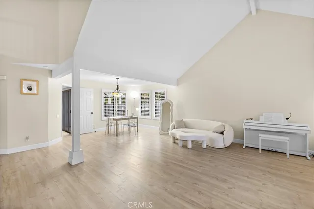 a spacious bedroom with a bed and a view of bathroom