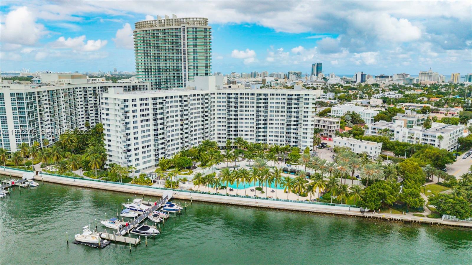 1500 Bay Road, Unit 1122S Miami Beach, FL 33139 - Photo 16 of 32 a view of a lake with tall buildings