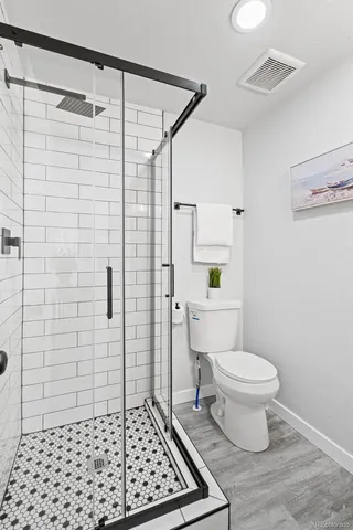 a bathroom with a sink a mirror and a shower