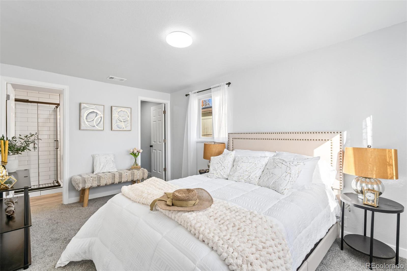 4831 Depew Street Denver, CO 80212 - Photo 15 of 35 a bedroom with a bed and wooden floor