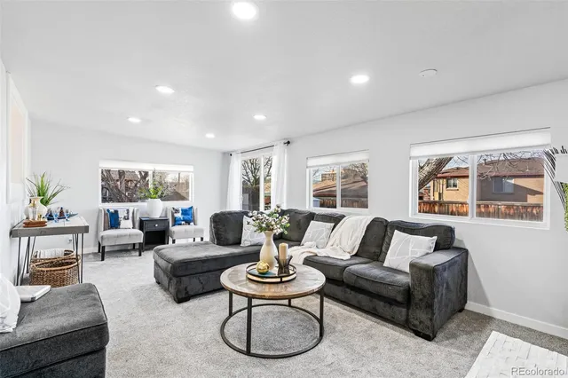 a open dining room with furniture and window
