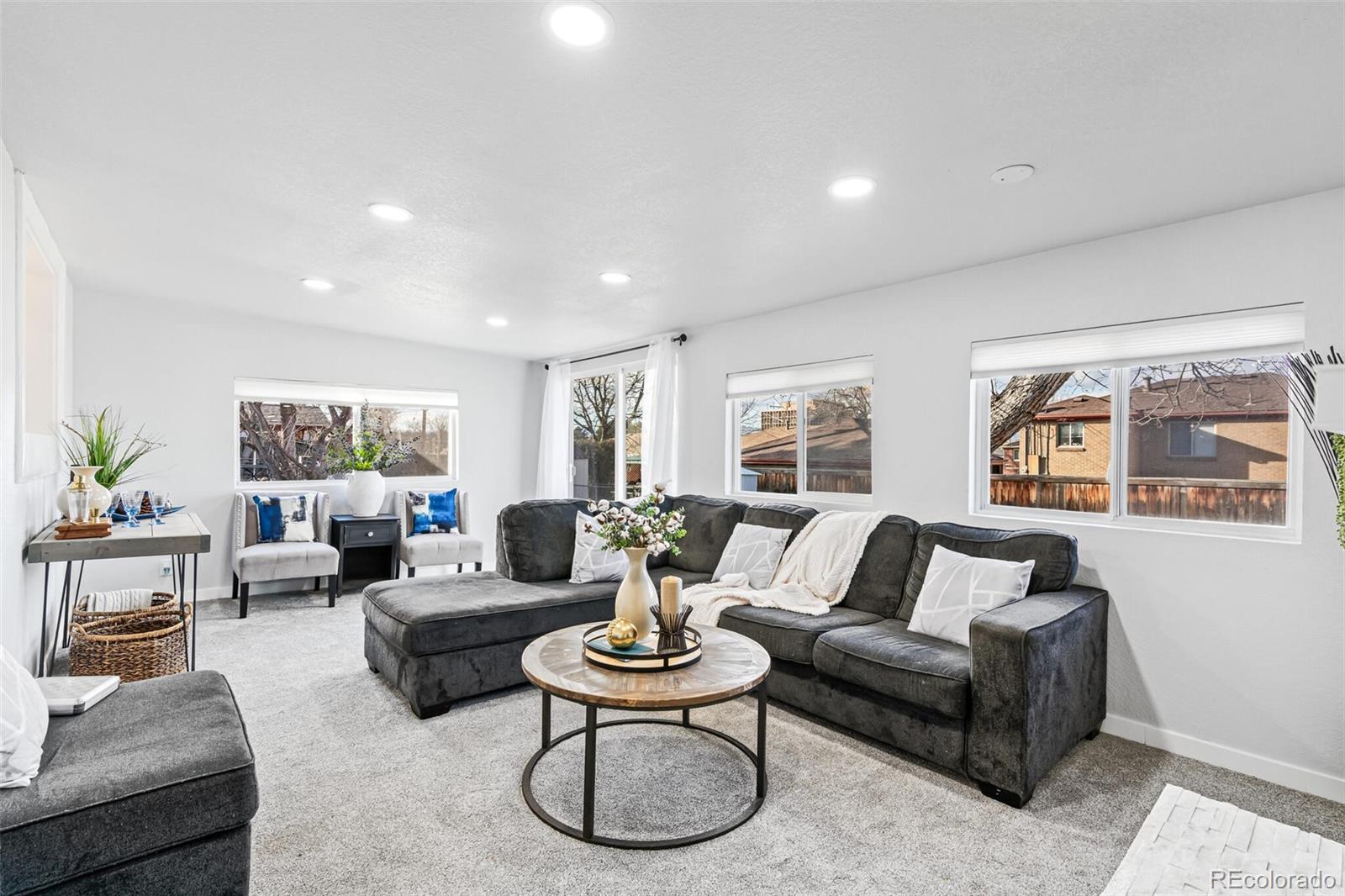 4831 Depew Street Denver, CO 80212 - Photo 19 of 35 a living room with furniture and a large window
