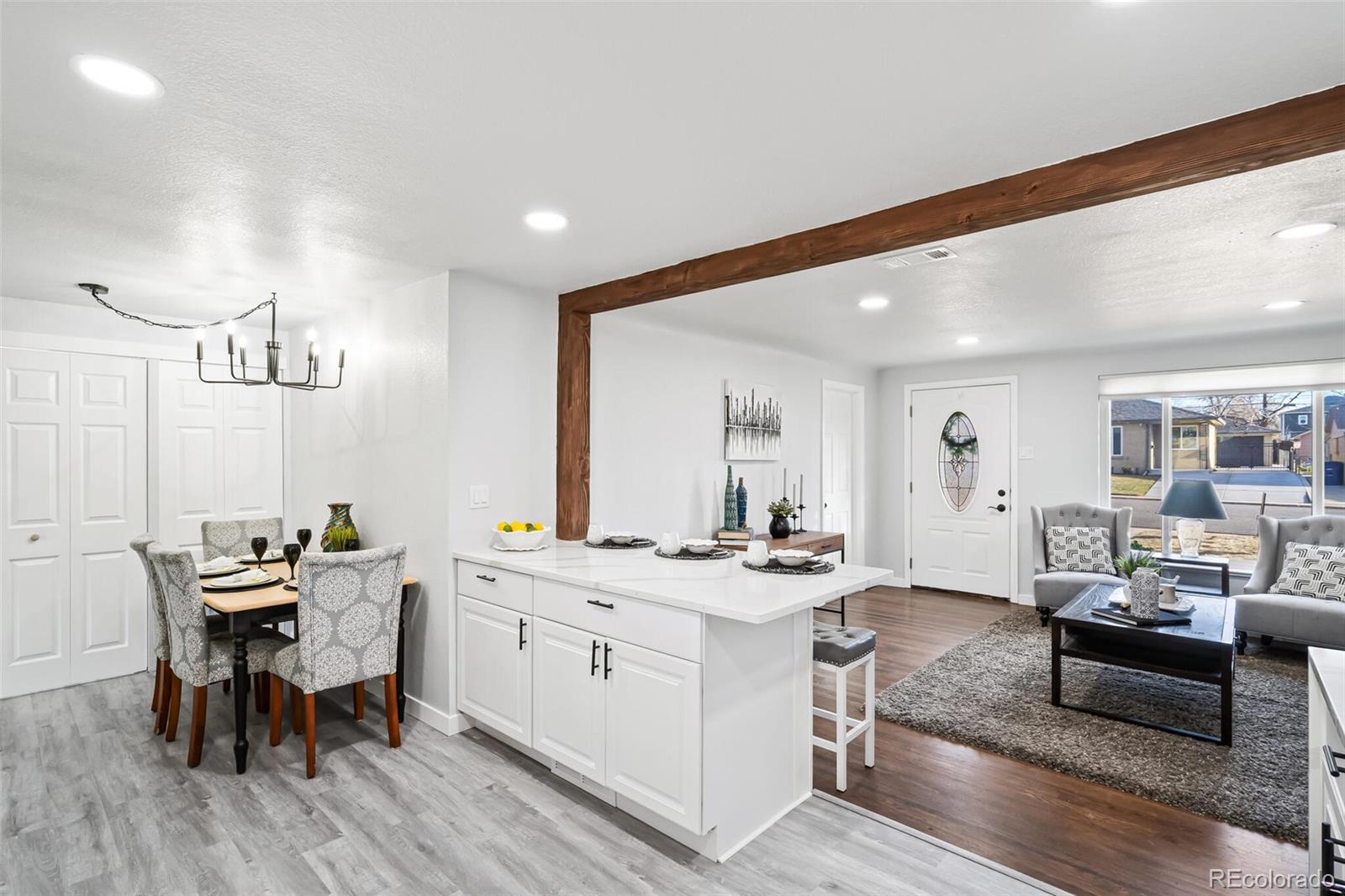 4831 Depew Street Denver, CO 80212 - Photo 21 of 35 a living room with furniture and wooden floor