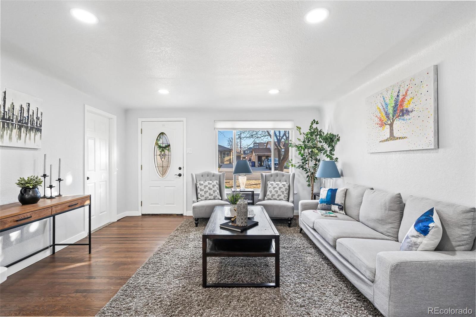 4831 Depew Street Denver, CO 80212 - Photo 29 of 35 a living room with furniture and wooden floor