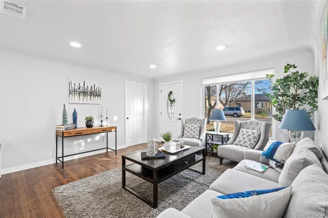 a living room with furniture and a table
