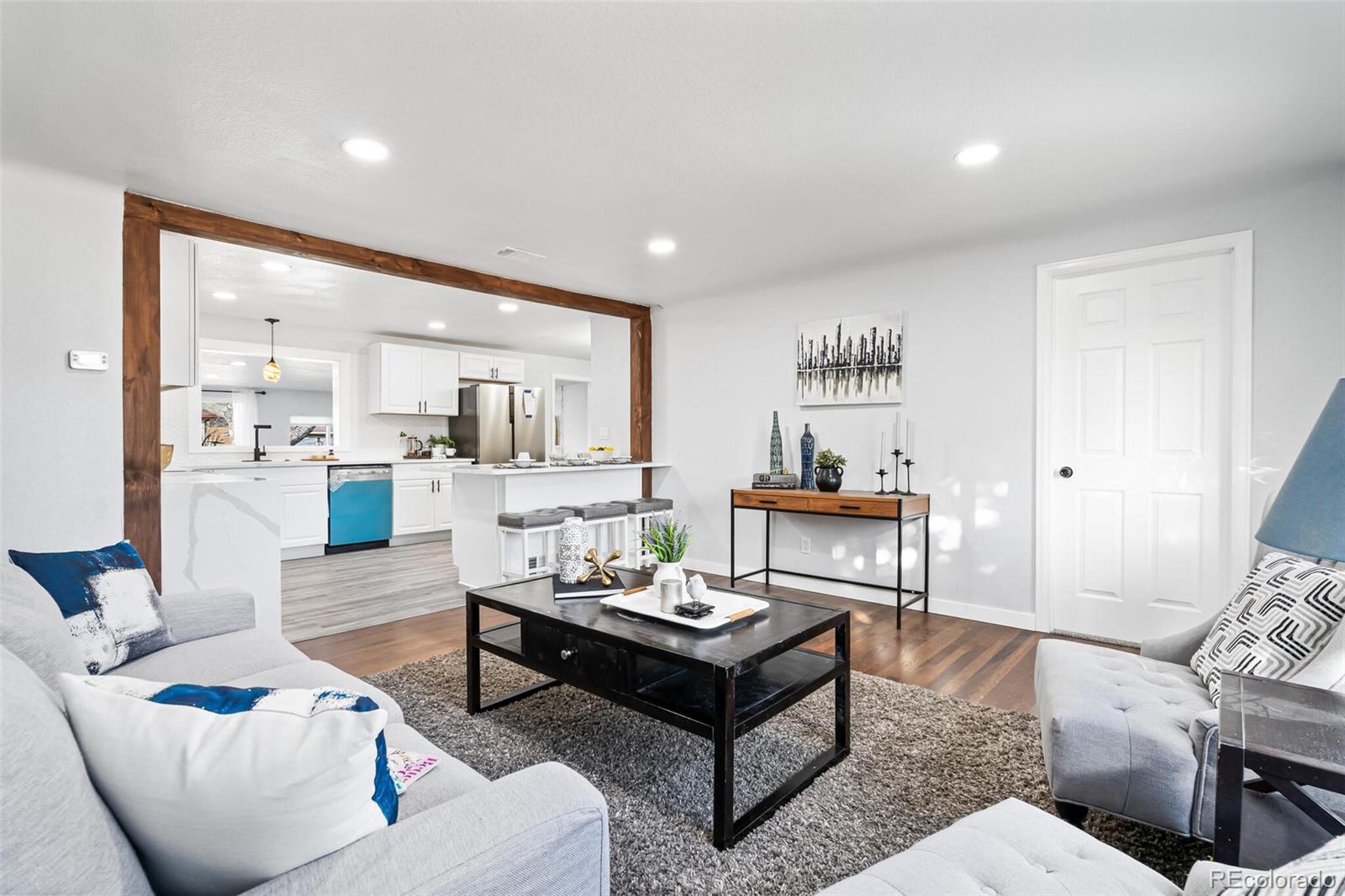 4831 Depew Street Denver, CO 80212 - Photo 31 of 35 a living room with furniture and a table