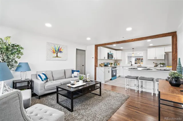 a front view of a house with a yard covered with snow