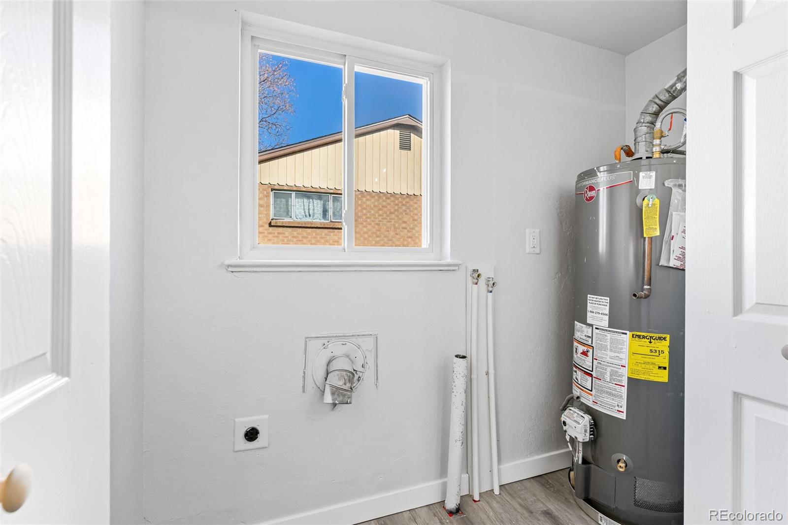 4831 Depew Street Denver, CO 80212 - Photo 7 of 35 a view of an entryway with wooden door