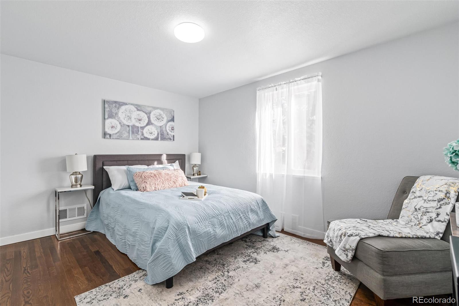 4831 Depew Street Denver, CO 80212 - Photo 10 of 35 a bedroom with a bed and a couch