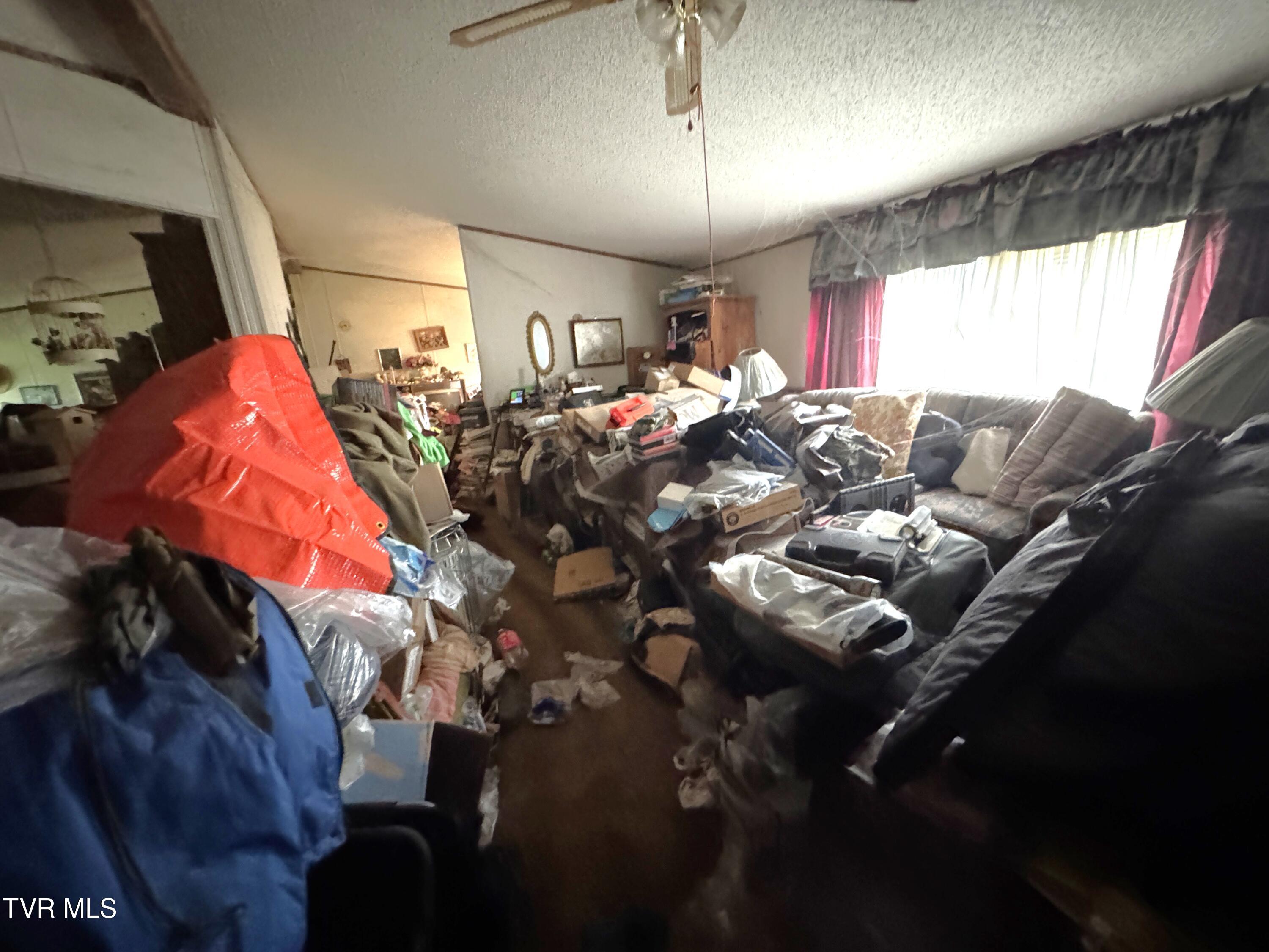 11616 Riverview Road Coeburn, VA 24230 - Photo 11 of 23 DOUBLEWIDE LIVING ROOM TOWARD FRONT WIND