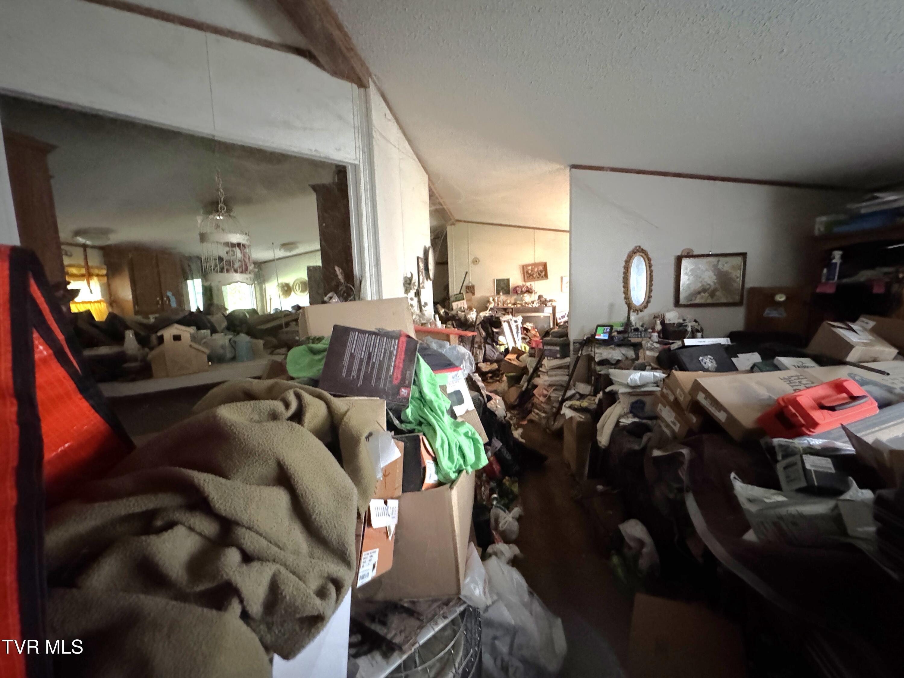 11616 Riverview Road Coeburn, VA 24230 - Photo 12 of 23 DOUBLEWIDE LIVING ROOM TOWARD HALLWAY