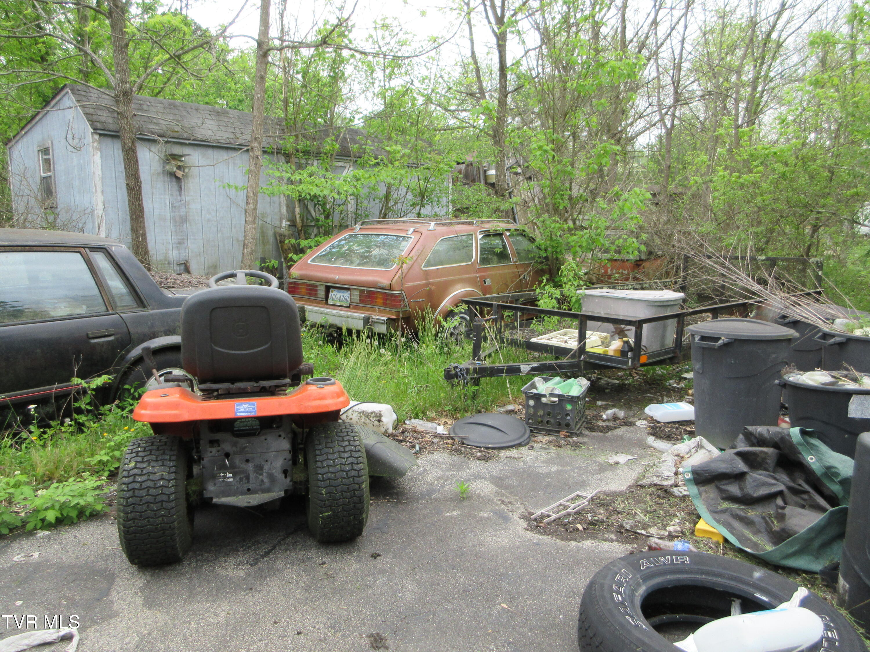 11616 Riverview Road Coeburn, VA 24230 - Photo 18 of 23 DEBRIS IN DRIVEWAY BEHIND HOUSE IN SPRIN