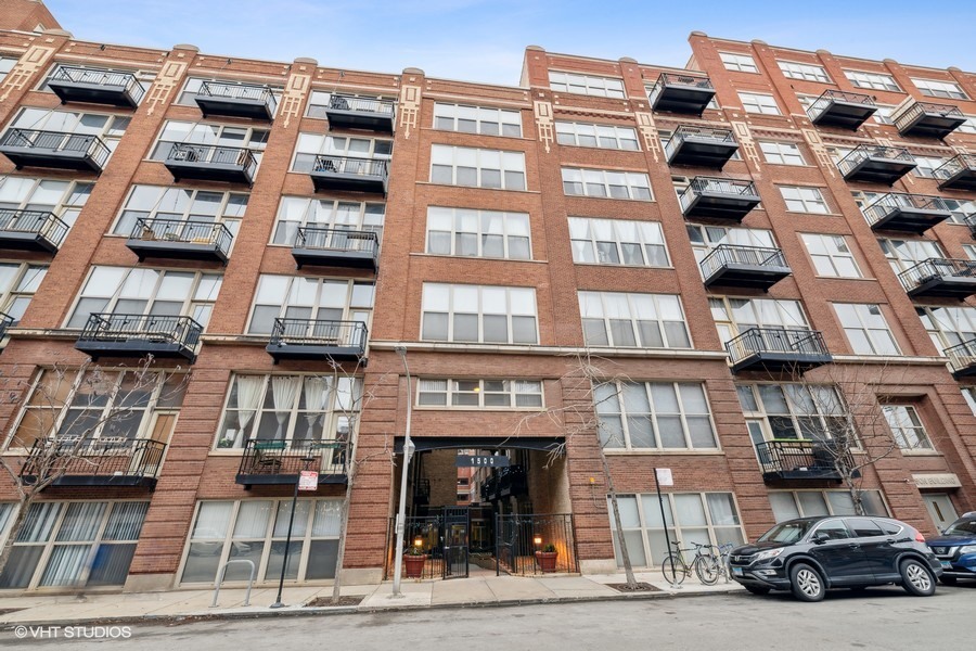 1500 West Monroe Street, Unit 518 Chicago, IL 60607 - Photo 1 of 14 a front view of a building with glass windows