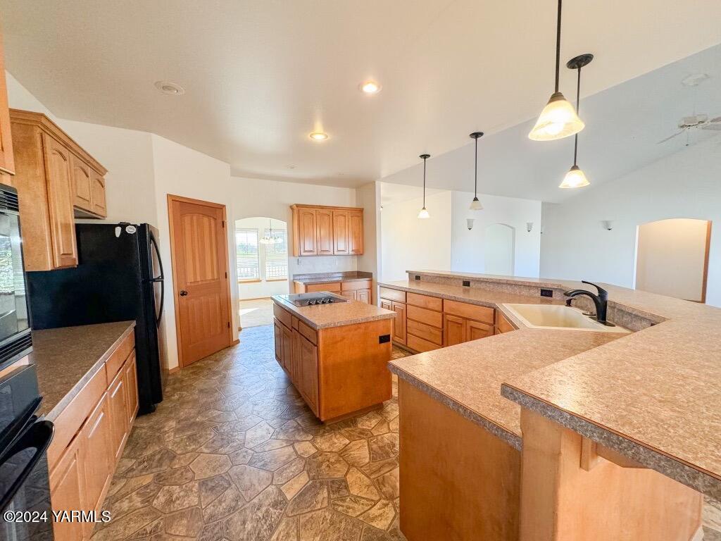 699 Alexander Road Sunnyside, WA 98944 - Photo 13 of 27 a large kitchen with a large counter top appliances and cabinets