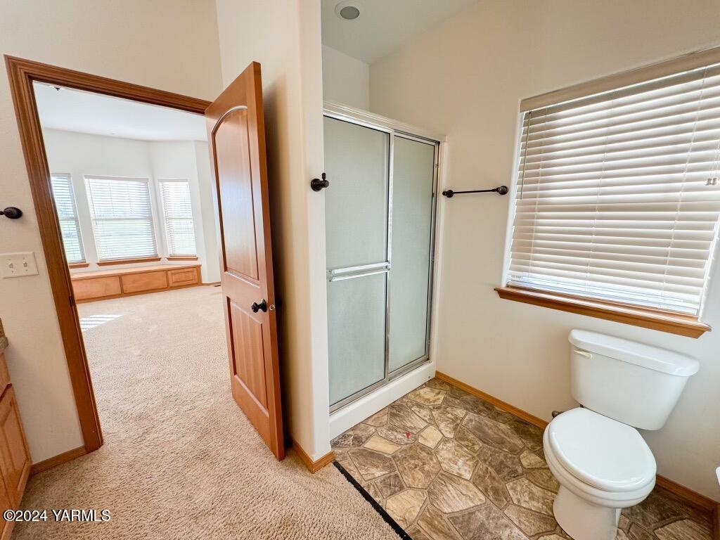 699 Alexander Road Sunnyside, WA 98944 - Photo 21 of 27 a bathroom with a granite countertop sink toilet and shower