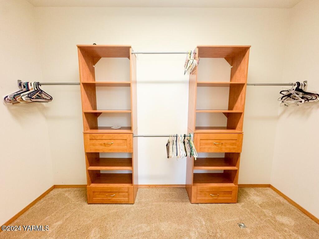 699 Alexander Road Sunnyside, WA 98944 - Photo 22 of 27 a view of walk in closet with empty racks