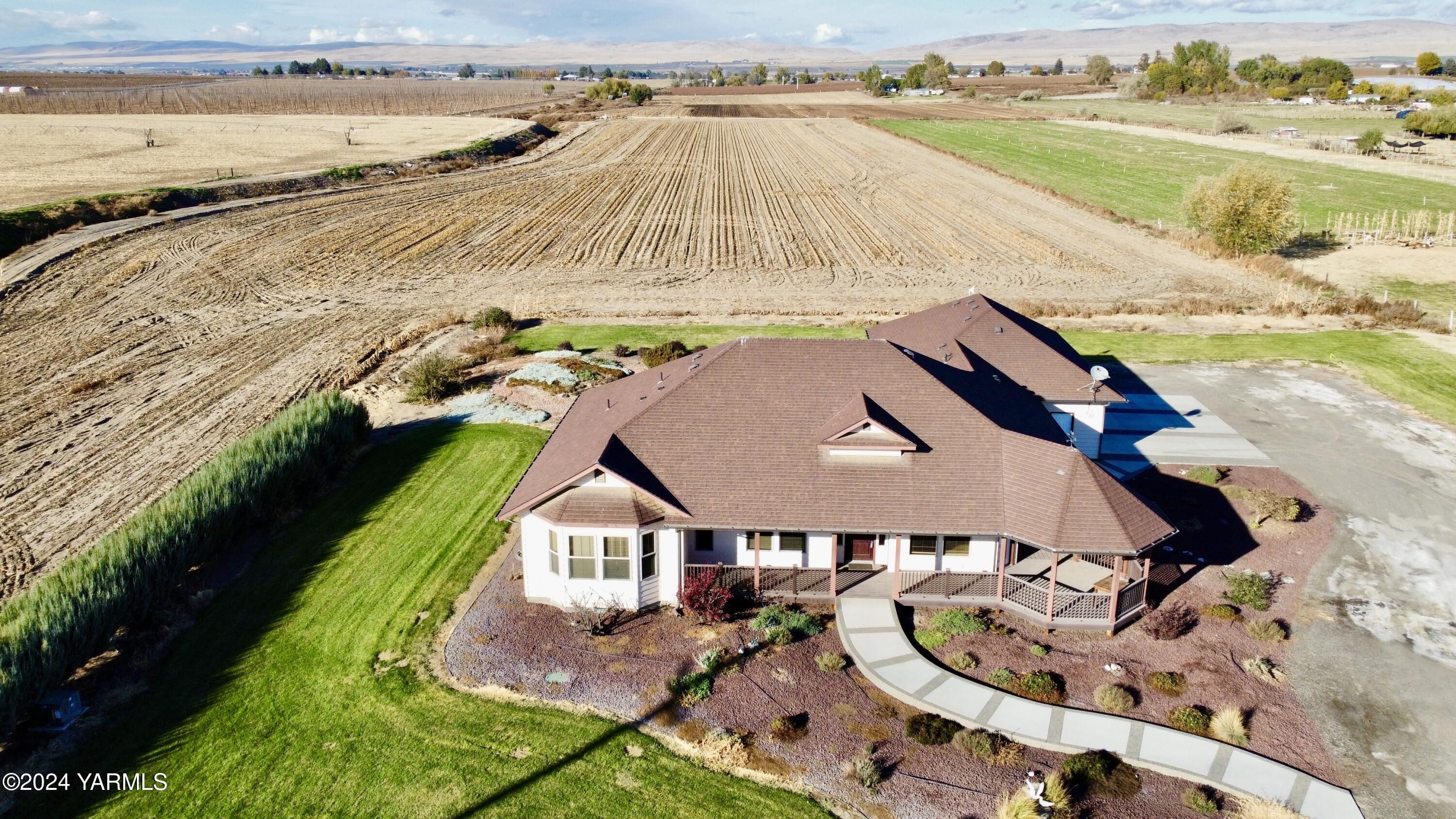 699 Alexander Road Sunnyside, WA 98944 - Photo 3 of 27 an aerial view of a house with a ocean view