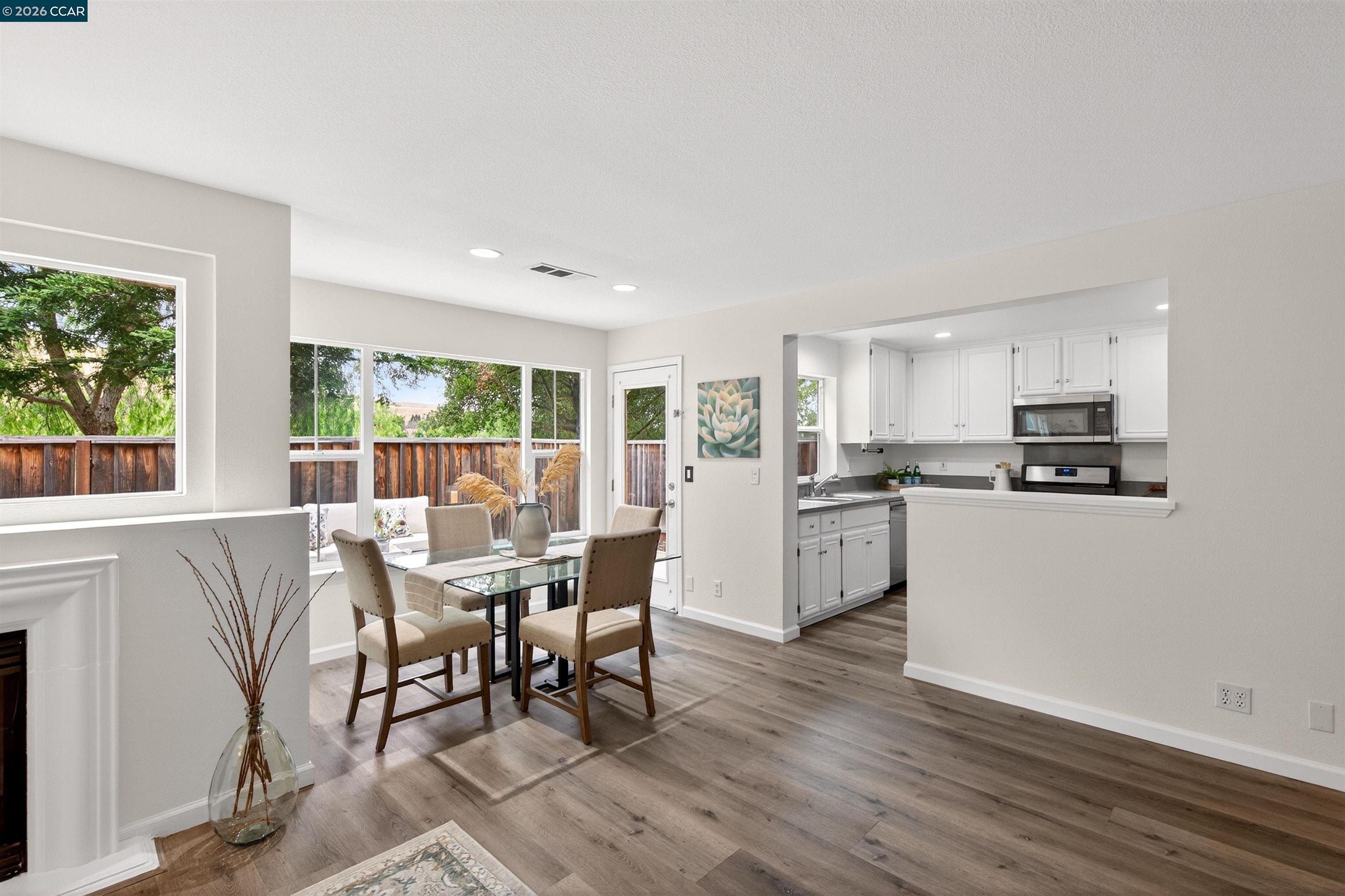 124 Coralflower Lane San Ramon, CA 94582 - Photo 8 of 47 a view of a dining room with furniture and wooden floor
