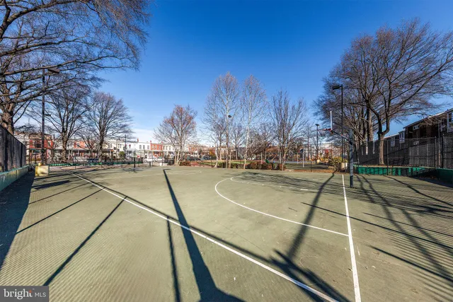 a view of swimming pool with outdoor seating and city view