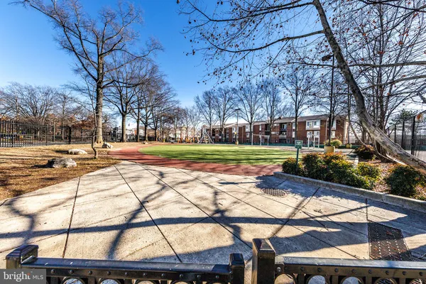 a view of a park with sitting area