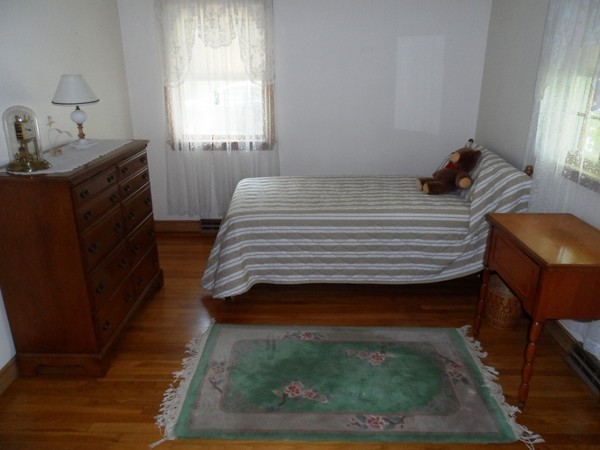 25 Eaton Road Framingham, MA 01701 - Photo 7 of 11 a bedroom with a bed and a window