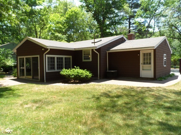 25 Eaton Road Framingham, MA 01701 - Photo 10 of 11 a view of a house with a yard and potted plants