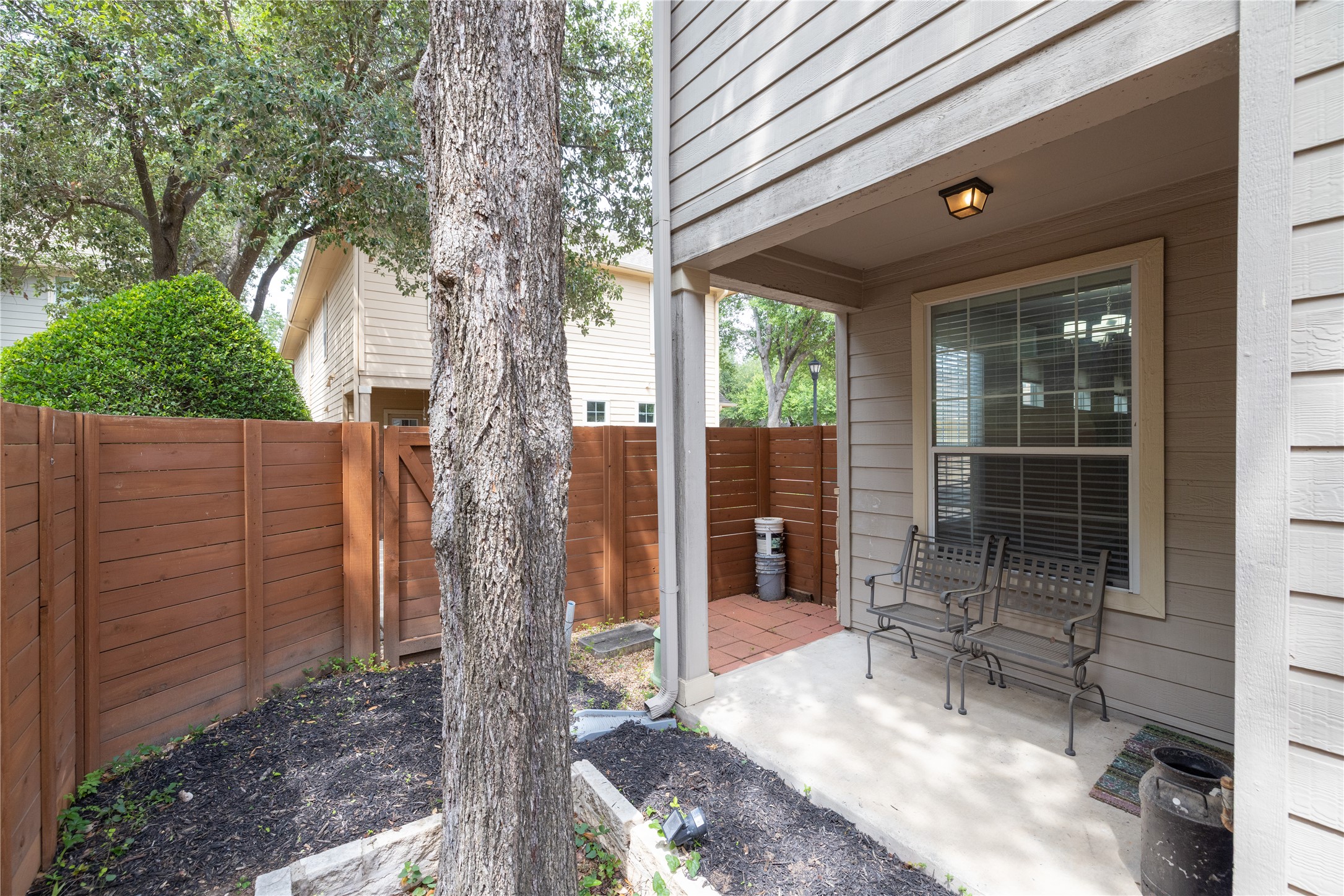 11000 Anderson Mill Road, Unit 45 Austin, TX 78750 - Photo 18 of 32 a front view of a house with a tree