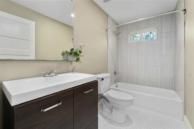 a bathroom with a sink a toilet and a bathtub