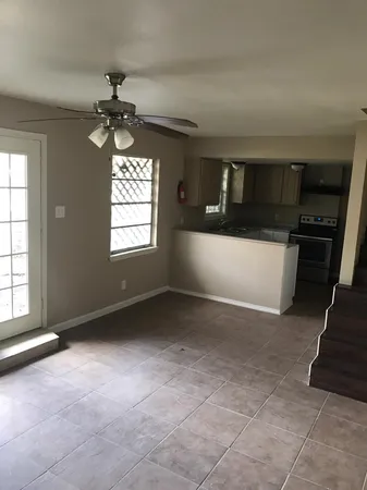 a kitchen with a stove and a refrigerator