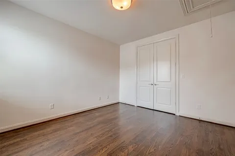 a view of an empty room and wooden floor