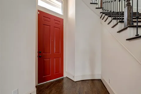 a view of front door with wooden floor