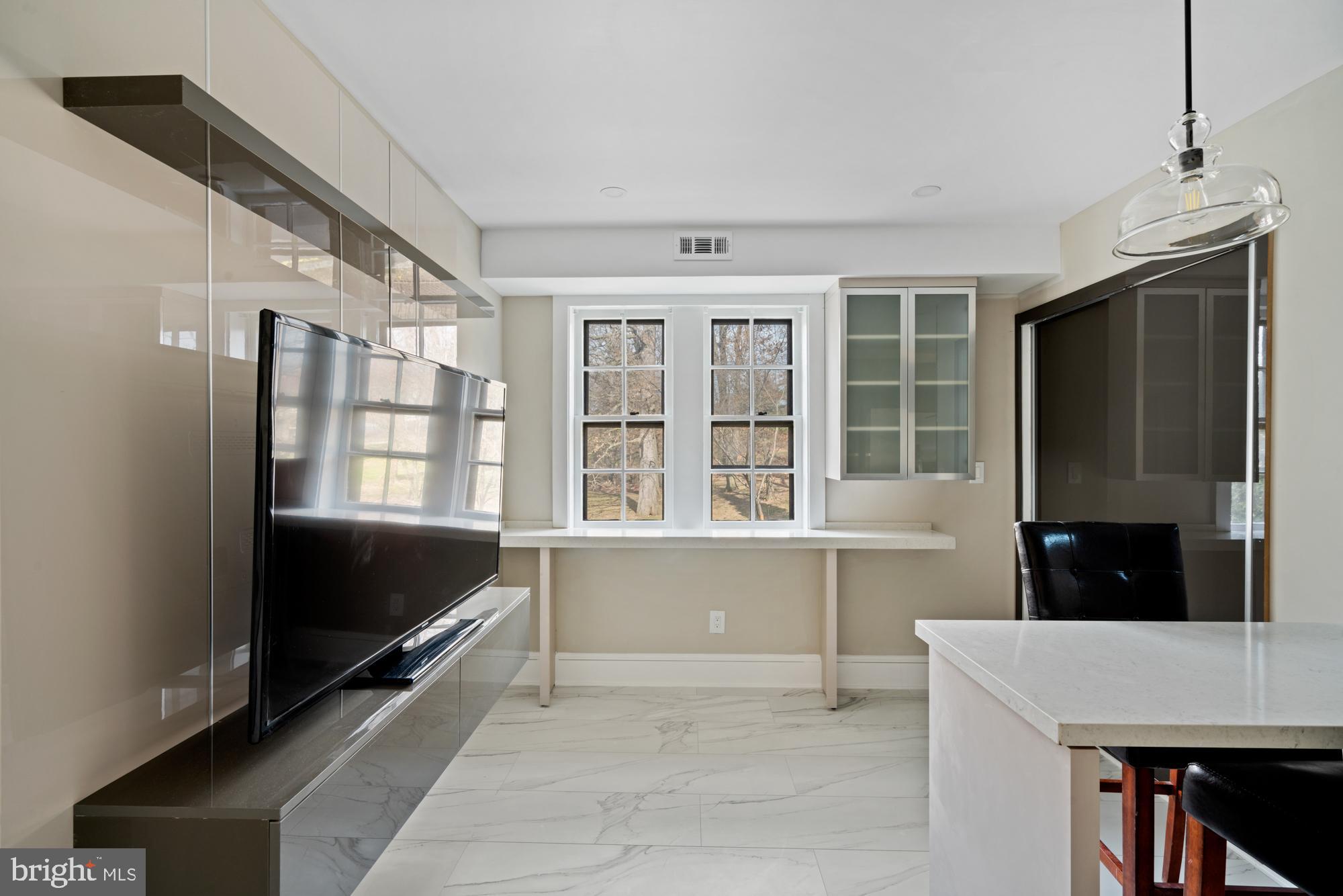 415 City Avenue, Unit I2 Merion Station, PA 19066 - Photo 11 of 35 a living room with stainless steel appliances granite countertop a refrigerator and a sink
