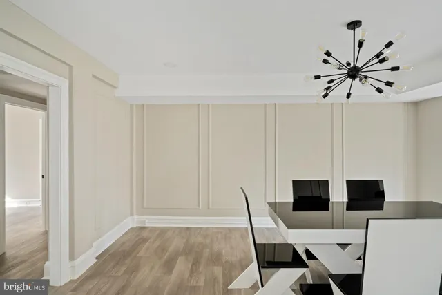 a view of a livingroom with furniture window and wooden floor