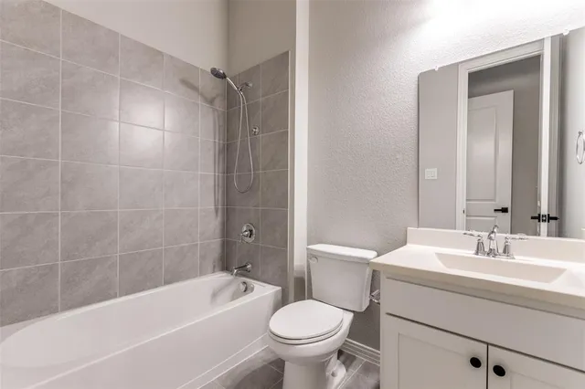 a bathroom with a sink toilet and bathtub