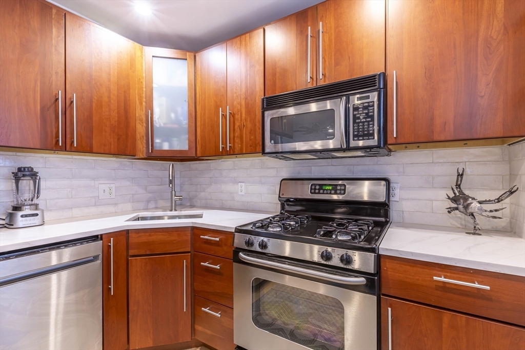 52 Cooper Street, Unit 2 Boston, MA 02113 - Photo 2 of 15 a kitchen with a sink stove and microwave