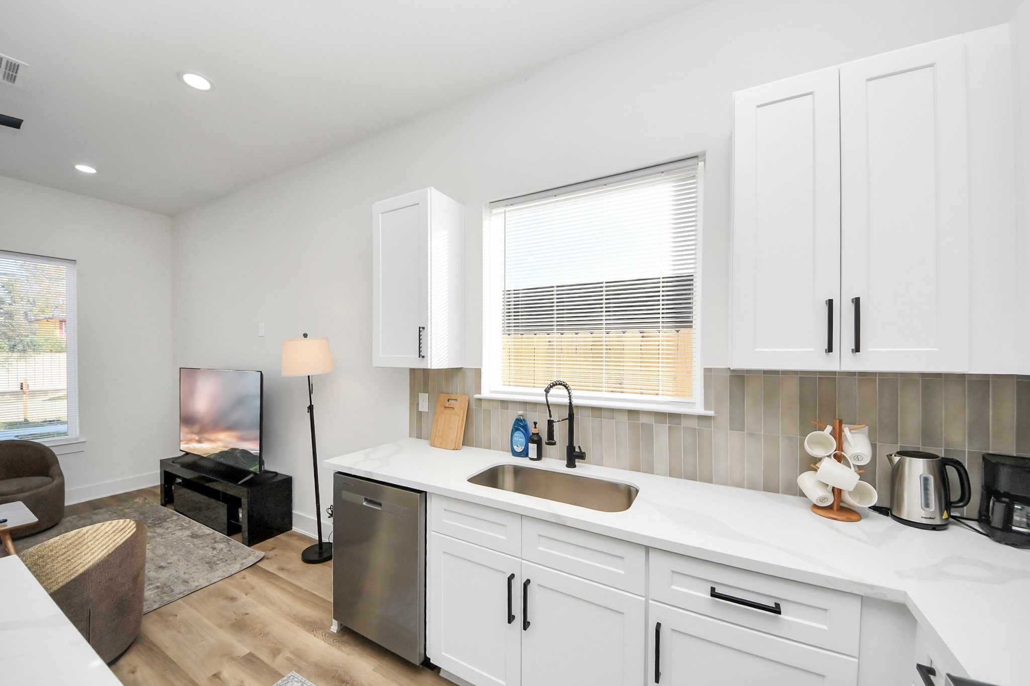 3909 Maggie Street Houston, TX 77051 - Photo 17 of 49 a kitchen with a sink cabinets and window