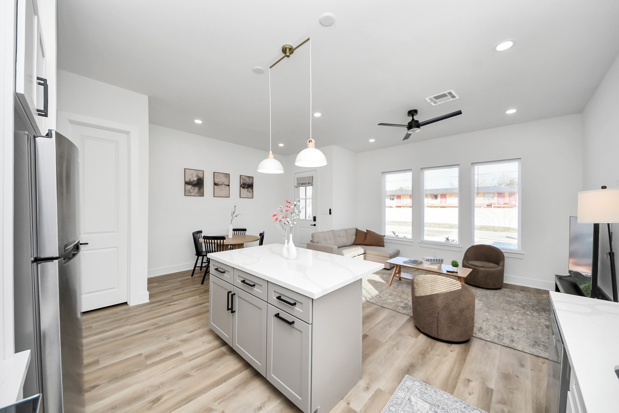 3909 Maggie Street Houston, TX 77051 - Photo 18 of 49 a large white kitchen with a large window a sink dishwasher and a counter top space