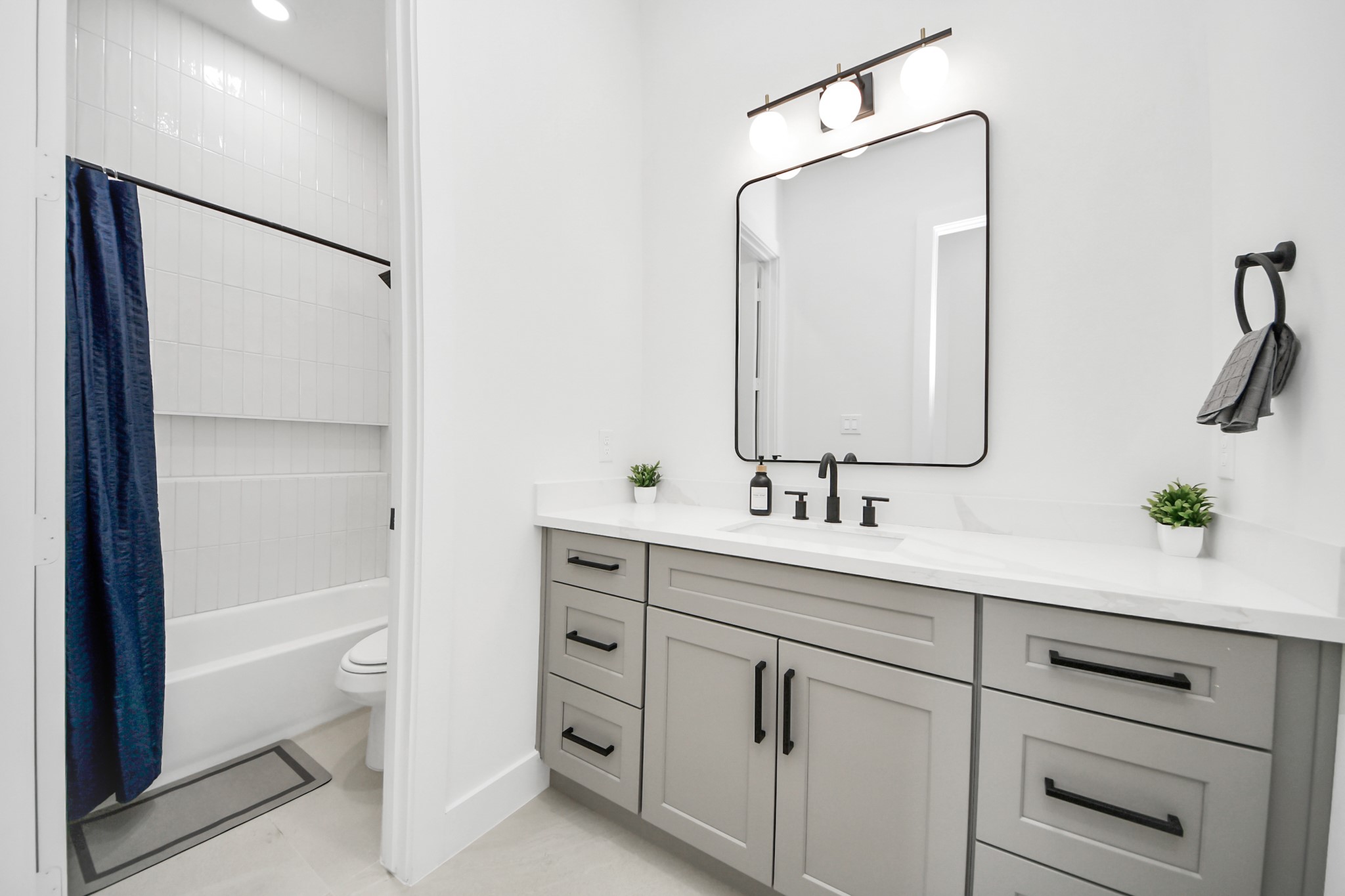 3909 Maggie Street Houston, TX 77051 - Photo 22 of 49 a bathroom with a double vanity sink mirror and toilet