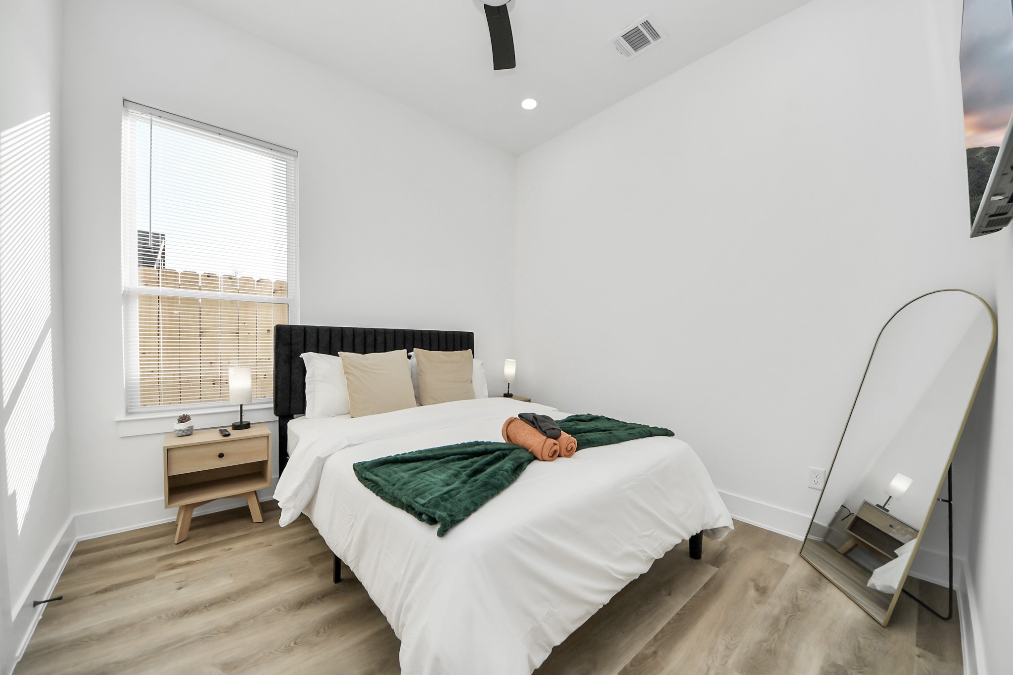 3909 Maggie Street Houston, TX 77051 - Photo 24 of 49 a bed sitting in a bedroom next to a window