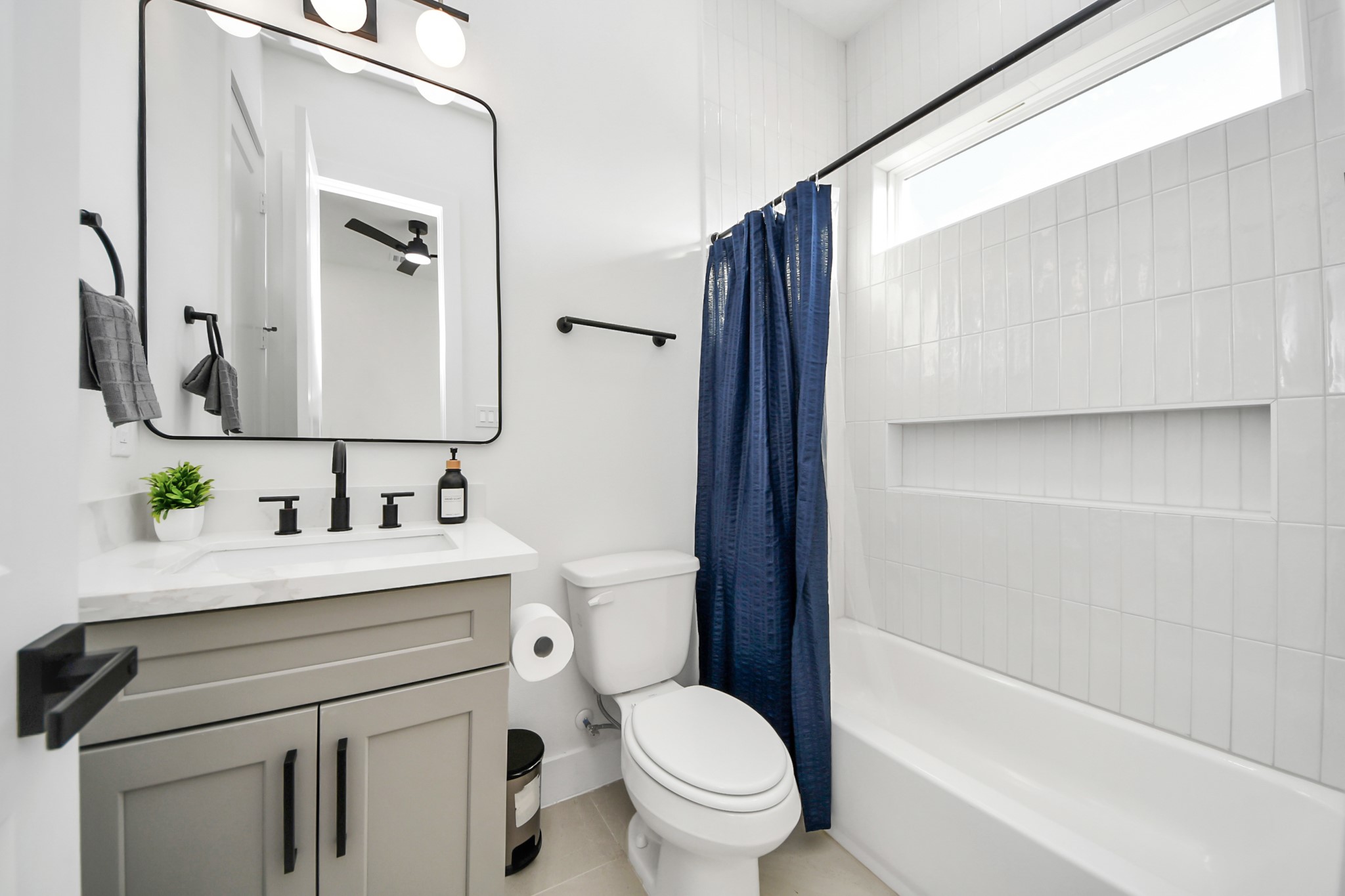 3909 Maggie Street Houston, TX 77051 - Photo 34 of 49 a bathroom with a sink a toilet a mirror and shower