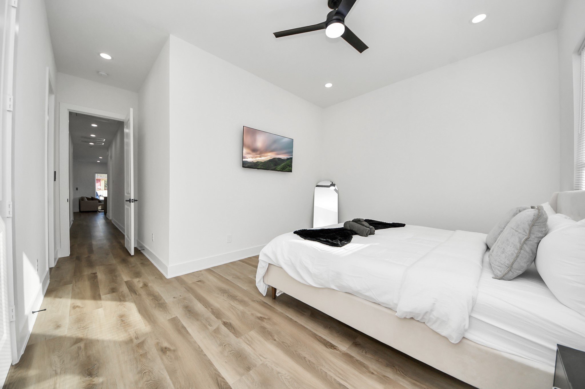 3909 Maggie Street Houston, TX 77051 - Photo 40 of 49 a bedroom with a bed and a painting on the wall