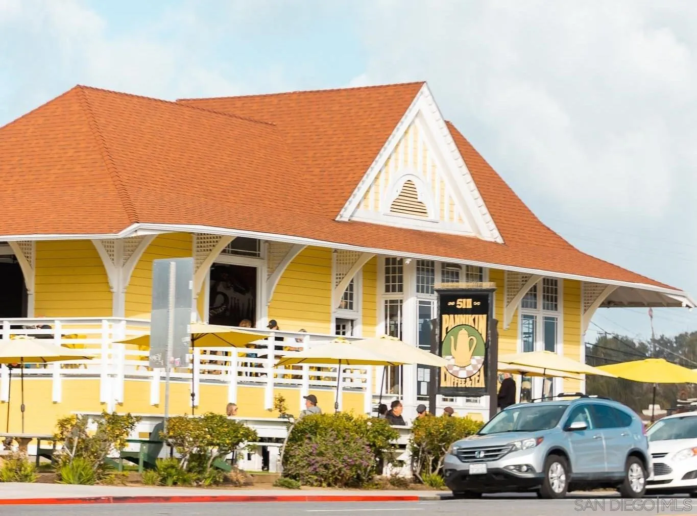 131 Edgeburt Drive Encinitas, CA 92024 - Photo 20 of 25 a front view of a residential apartment building with a yard