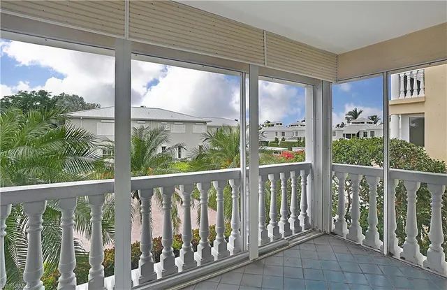 a view of balcony with wooden floor