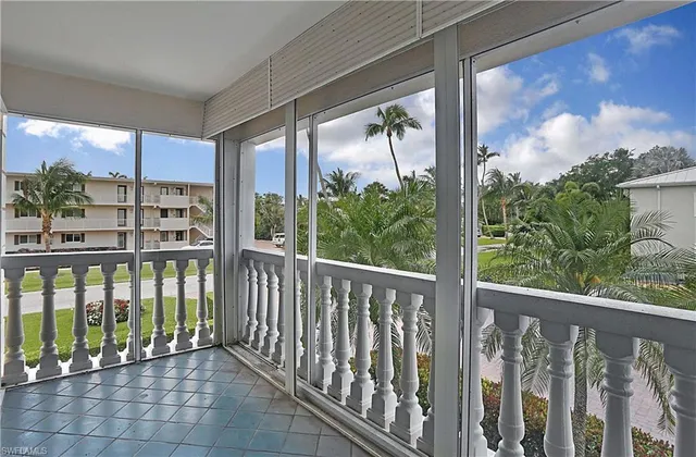 a view of a balcony with wooden floor