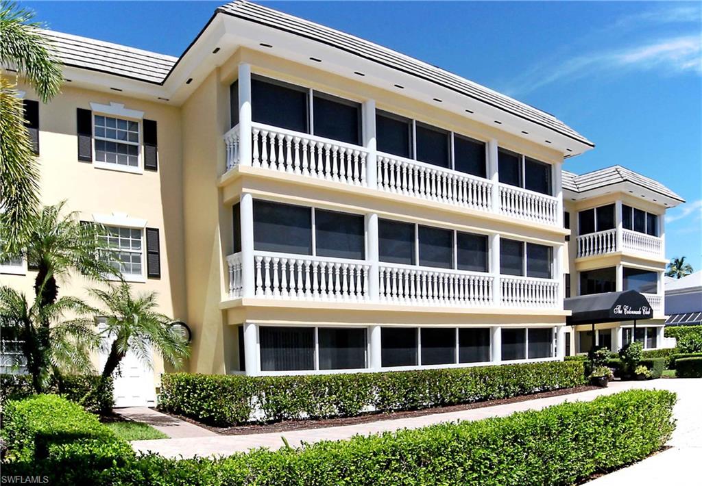 666 3rd Street South, Unit 201 Naples, FL 34102 - Photo 15 of 19 a front view of a house with a yard