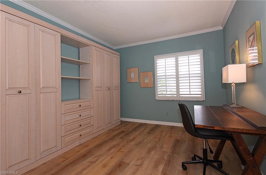 666 3rd Street South, Unit 201 Naples, FL 34102 - Photo 9 of 19 a view of a workspace with furniture and a window