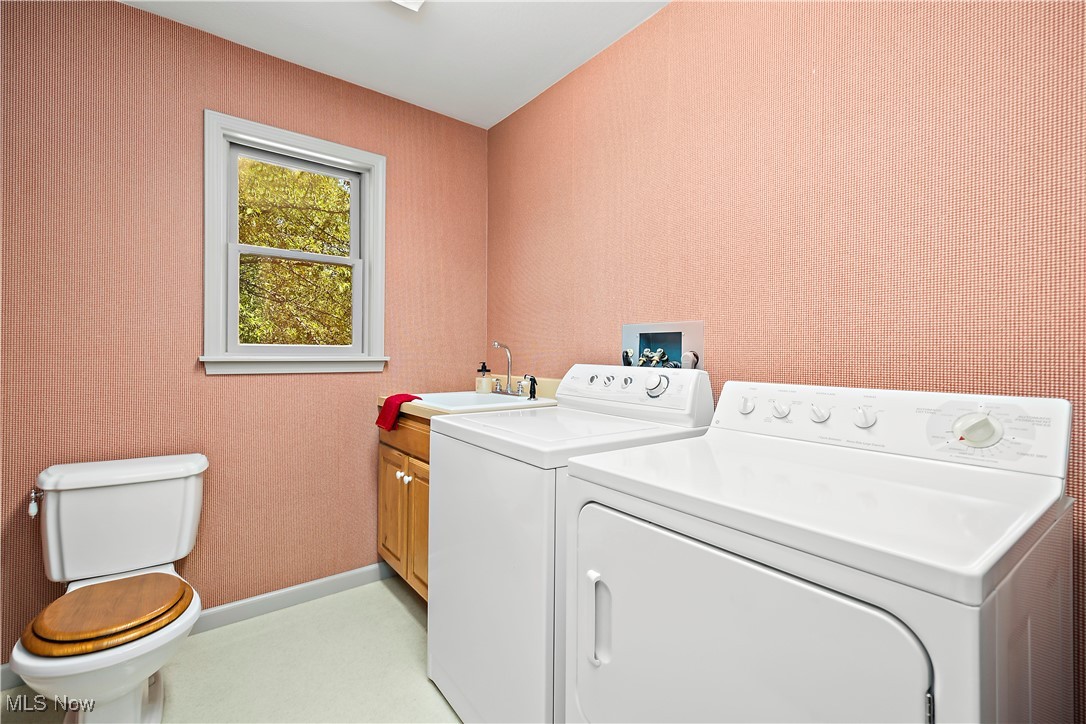 13901 Shaw Mill Road Milan, OH 44846 - Photo 26 of 42 Laundry room with washing machine and dryer and sink