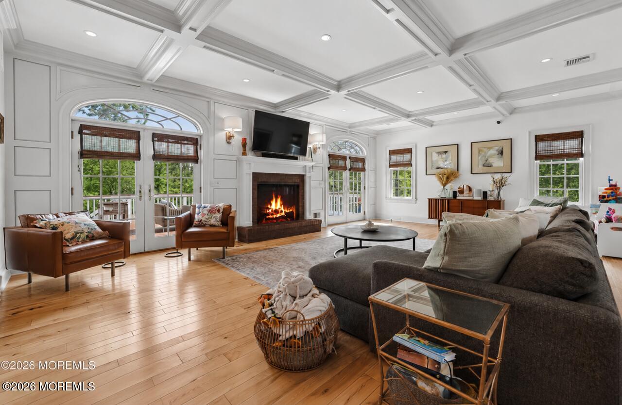 92 Tulip Lane Colts Neck, NJ 07722 - Photo 9 of 55 a living room with furniture fireplace and a large window