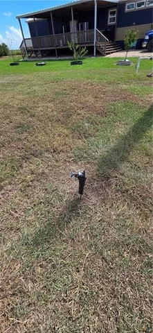 a view of a tiny house with a yard